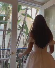 Load and play video in Gallery viewer, Romantic White Off-the-Shoulder Homecoming Dress with Bow Front and Lace Details